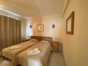 Postel nebo postele na pokoji v ubytování Luz dream apartment 22G above beach