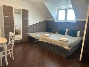 Postel nebo postele na pokoji v ubytování Beauty Complex