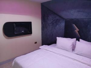Voodi või voodid majutusasutuse Ivy Hotel - Epe toas