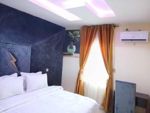 Voodi või voodid majutusasutuse Ivy Hotel - Epe toas