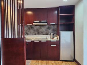 A kitchen or kitchenette at Kota Kinabalu City Ensuite at SCSP Ming Garden