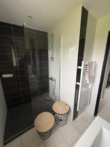 a bathroom with two stools and a shower at La Petite Baie in Pleine-Fougères +19 photos