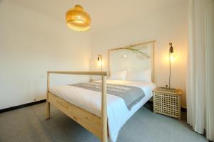 Ένα ή περισσότερα κρεβάτια σε δωμάτιο στο Gongxi Homestay Bell Tower Big Wild Goose Pagoda Tang Dynasty City Terracotta Warriors
