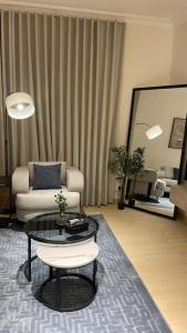 a living room with a couch and a coffee table at life style apartment in Dhahran +14 photos