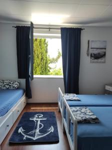 Ένα ή περισσότερα κρεβάτια σε δωμάτιο στο Blue&Green Apartment +41 φωτογραφίες