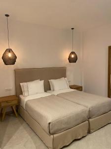 Posteľ alebo postele v izbe v ubytovaní Anna-Maria Mykonos Hotel