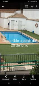 a screenshot of a website with a swimming pool at VFT LA PAZ II in Baeza