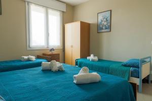 Postel nebo postele na pokoji v ubytování {Lux Kobler} - Luminoso Appartamento Fronte mare