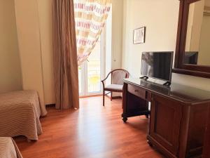 TV o dispositivi per l'intrattenimento presso Hotel Archimede Ortigia