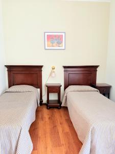 Letto o letti in una camera di Hotel Archimede Ortigia