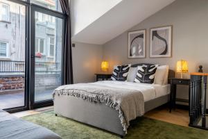 a bedroom with a bed and a large window at Fourlex Single Detached House - 2 Bathrooms - Central Location - Private Terrace in Istanbul