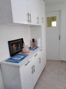 Kuchyň nebo kuchyňský kout v ubytování La maison de Ja + 10 fotografií