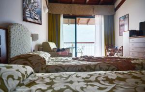 Posteľ alebo postele v izbe v ubytovaní Hotel Ilma Lake Garda Resort