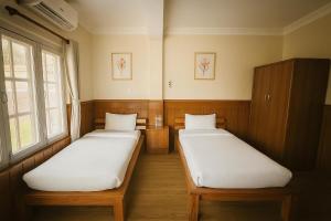 Letto o letti in una camera di Hotel Suva