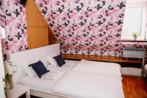 Postel nebo postele na pokoji v ubytování Hostel Centar