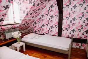Postel nebo postele na pokoji v ubytování Hostel Centar