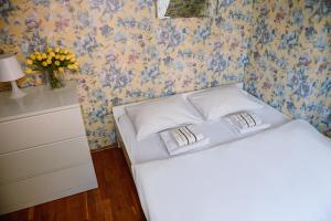 Postel nebo postele na pokoji v ubytování Hostel Centar