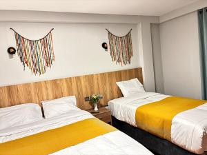 Postel nebo postele na pokoji v ubytování Hotel Litan Machu Picchu