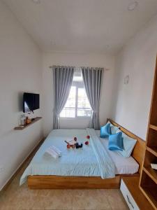 Rúm í herbergi á BIKA Hostel and Dorm