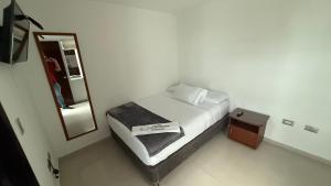 Ένα ή περισσότερα κρεβάτια σε δωμάτιο στο Hotel Villa María Coworking