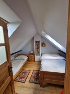 Posteľ alebo postele v izbe v ubytovaní Apartament Buczyna