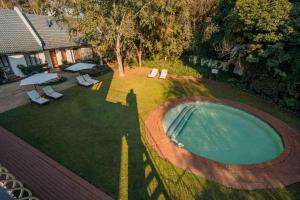 an overhead view of a backyard with a swimming pool at Budmarsh Country Lodge in Magaliesburg