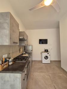 A kitchen or kitchenette at Sicily Neapolis Apartment & Rooms