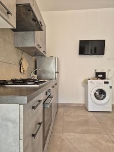 A kitchen or kitchenette at Sicily Neapolis Apartment & Rooms