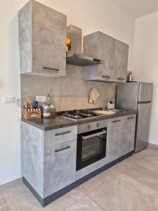 A kitchen or kitchenette at Sicily Neapolis Apartment & Rooms