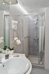 a bathroom with a shower and a toilet and a sink at Villa Romantica Hotel in Paleo Tsifliki +72 photos