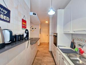 a kitchen with a sink and a counter top at Terrace between Rome and the sea in Vitinia