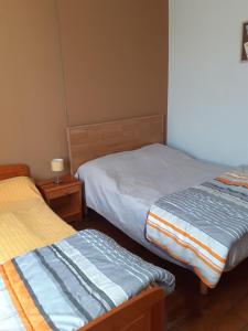 Ένα ή περισσότερα κρεβάτια σε δωμάτιο στο Gîte Val d'Oire et Gartempe