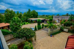 an aerial view of a backyard with a tennis court at QUALITY INN HOTEL Kigali in Kigali