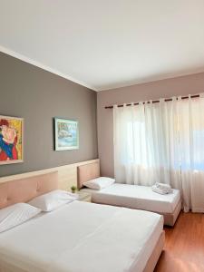 Postel nebo postele na pokoji v ubytování Hotel Bojko