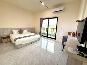 Ένα ή περισσότερα κρεβάτια σε δωμάτιο στο Mo Bi