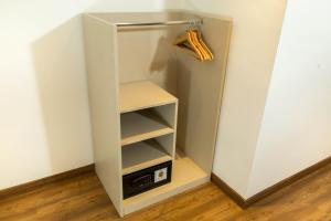 a small white refrigerator with its door open at Hotel BESTPRICE Gracia in Barcelona