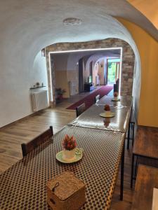 a dining room with a table and chairs in a room at Casa Regina 21 - Families & Friends Dolomites in Ponte delle Arche