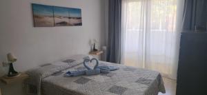 Una cama o camas en una habitación de Casita El Destino 30 fotos más