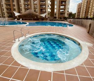 a large hot tub in the middle of a building at Ambar - estadía de lujo en Villeta in Villeta