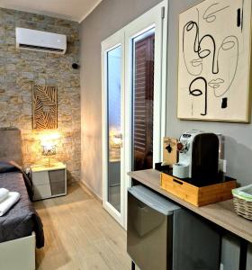 a kitchen with a counter with a microwave in a room at Chalet Ponte Paradiso Suite & SPA in Santa Cristina Gela +32 photos