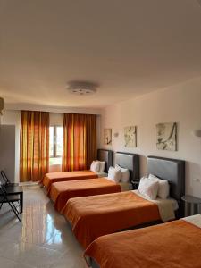 Postel nebo postele na pokoji v ubytování Azayla Hotel