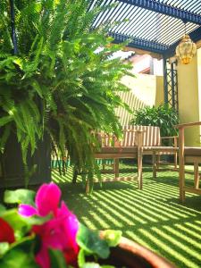 A garden outside City Rooftop Paradise - Space Maison Apartments