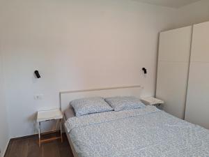 Postel nebo postele na pokoji v ubytování Apartman Damir