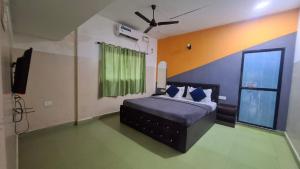 Postel nebo postele na pokoji v ubytování Bhattacharya holiday homes goa