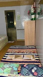 two beds sitting next to each other in a room at Cabongaoan Beach, Burgos, Pangasinan  +30 photos