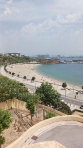 a view of a beach with people on it at GBT Quartos in Sines