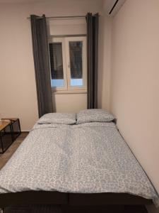 Postel nebo postele na pokoji v ubytování Apartman Damir
