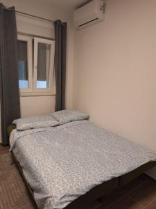 Postel nebo postele na pokoji v ubytování Apartman Damir