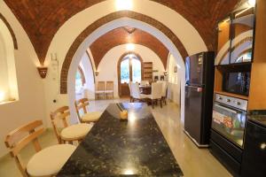 a kitchen and dining room with a table and chairs at Desert Rose apartment's in Luxor
