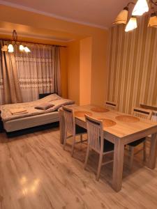 Ένα ή περισσότερα κρεβάτια σε δωμάτιο στο Apartament Krupińskiego